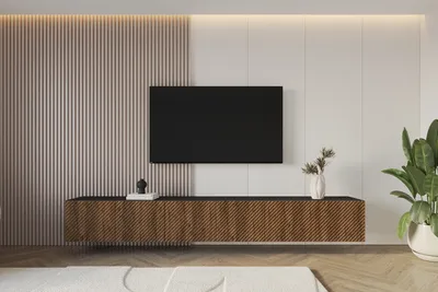 A modern living room with a wall-mounted TV and media console.