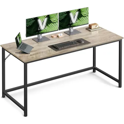 A desk with two monitors, a laptop, keyboard, and mouse.