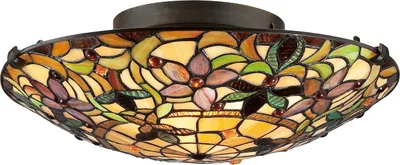 A Tiffany-style flush mount ceiling light with a stained glass shade.