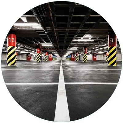 Produktbild von Wallario Premium Glasbild, freischwebende Optik, kräftige Farben, rund 50cm Durchmesser, Motiv Perspektive von unten leeres Parkhaus im Untergrund