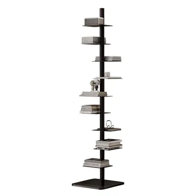A tall, narrow, black metal bookshelf with multiple shelves holding books and a small decorative elephant.