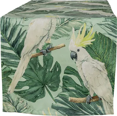Two white cockatoos with yellow crests are perched on branches against a background of lush green tropical leaves.
