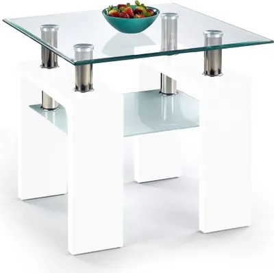A modern white coffee table with a glass top and a bowl of fruit.