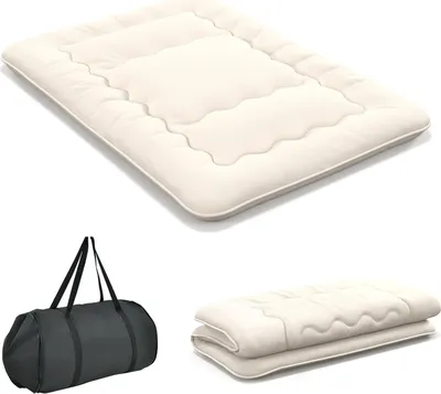 A beige futon mattress is shown unfolded and then folded, alongside a black duffel bag.