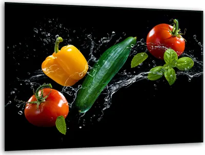 Vegetables with water splashes on a black background.