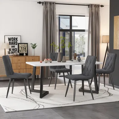 A dining room scene with a table and chairs.