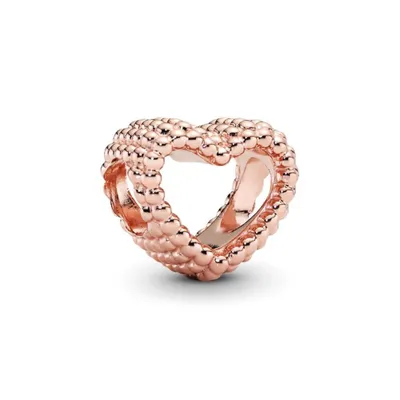 A rose gold heart-shaped charm with a beaded texture.