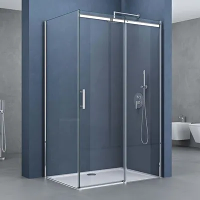 A modern bathroom with a glass shower enclosure.
