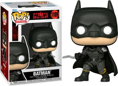 A Funko Pop! vinyl figure of Batman from the movie "The Batman" is shown in its packaging and standing next to it.
