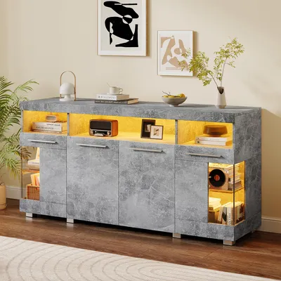 A modern gray sideboard with LED lighting is displayed in a living room setting, showcasing decorative items and books.