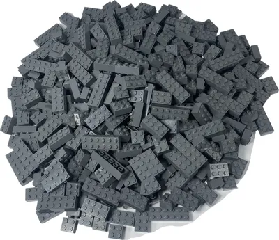 A pile of dark gray LEGO bricks on a white background.