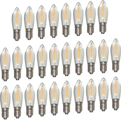A collection of LED filament light bulbs arranged in rows on a white background.