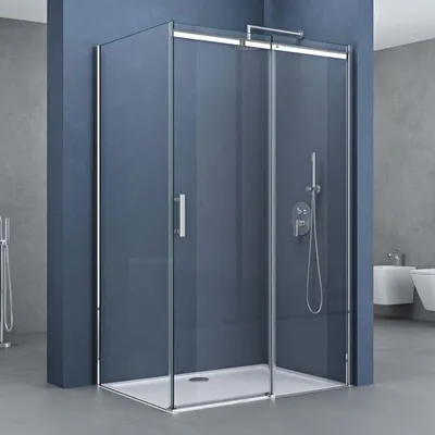 A modern bathroom with a glass shower enclosure.