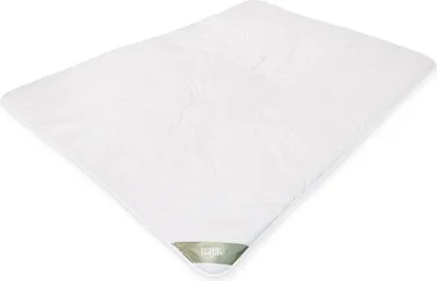 A white duvet is laid out on a white background.