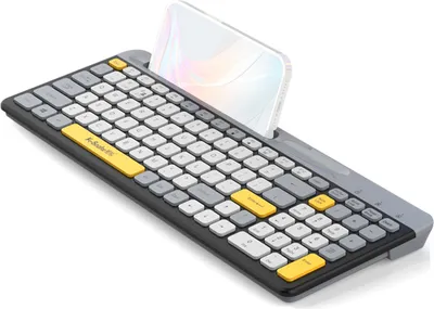 A wireless keyboard with a phone holder, displaying the keyboard and a smartphone. The background is plain white.