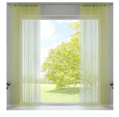 A window with light green string curtains, showing a sunny outdoor scene with a large tree.