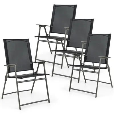 Four black folding chairs are arranged in a group on a white background.