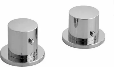 Two chrome-plated faucet handles on a white background.