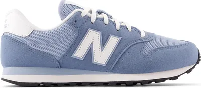 A side view of a single New Balance sneaker.