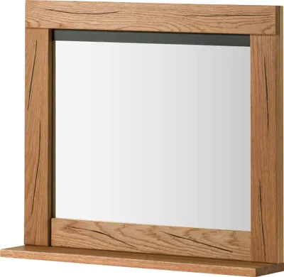 A wooden framed mirror with a shelf below.