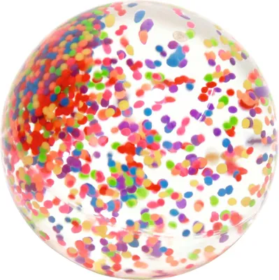 A close-up, studio shot of a clear bouncy ball filled with colorful confetti.