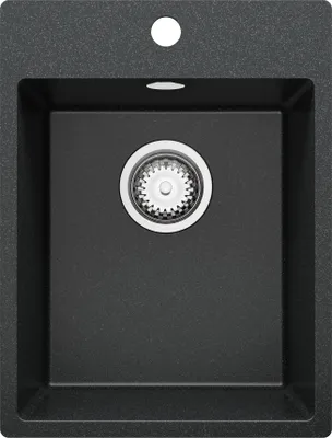 A top-down view of a black granite kitchen sink with a silver drain.