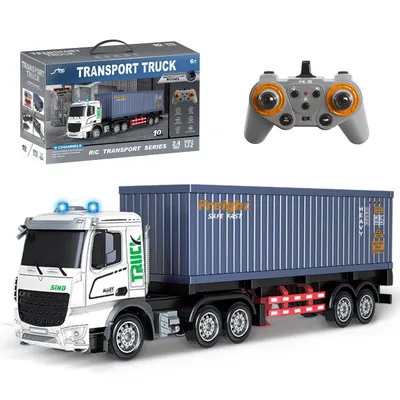 A remote-controlled truck with a container trailer, its remote control, and its packaging, all presented against a white background.