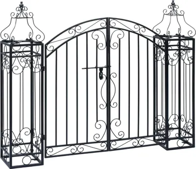 A black wrought iron garden gate with decorative scrollwork and two flanking pillars.
