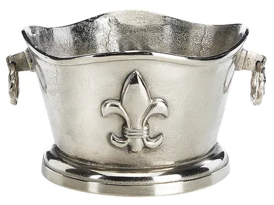 A silver-colored metal ice bucket with a fleur-de-lis emblem.