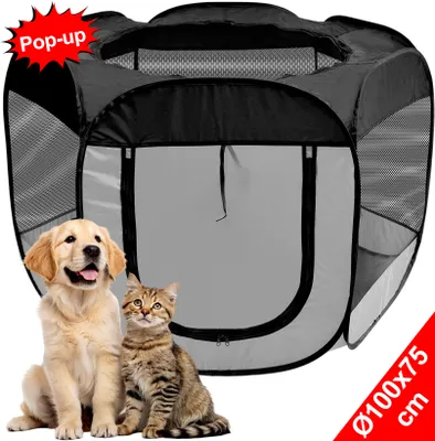 A pop-up pet playpen with a golden retriever puppy and a tabby kitten sitting in front of it.