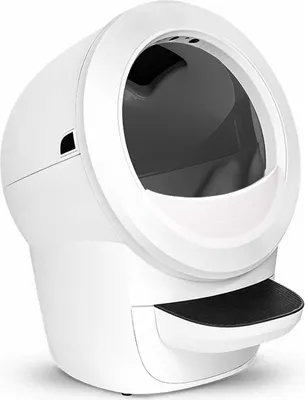 A white automatic self-cleaning litter box with a black litter tray.