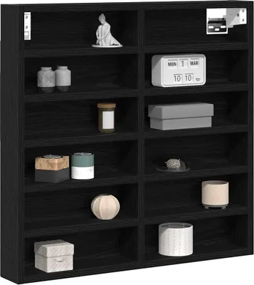 A black wooden display shelf filled with various decorative items.
