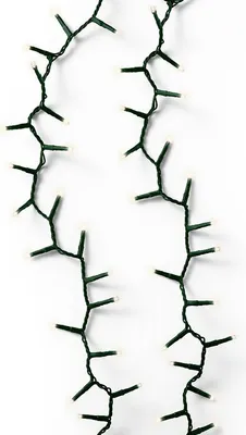 Two strands of green Christmas lights with warm white LEDs are shown against a white background.