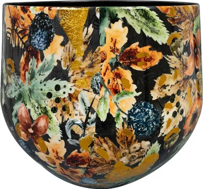 A close-up view of a decorative pot with a floral and leaf pattern.