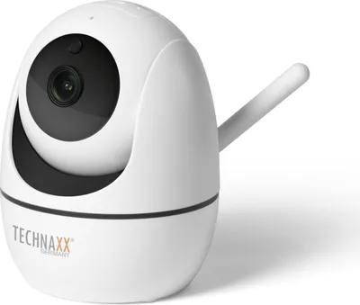 A white Technaxx PT IP security camera with a black lens and an antenna is shown against a white background.