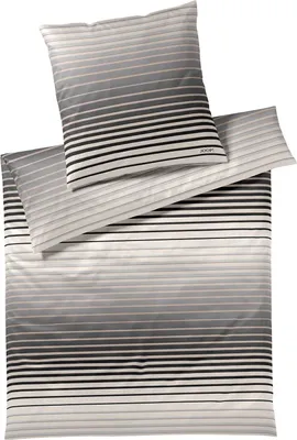 A set of bedding with a striped gradient pattern.