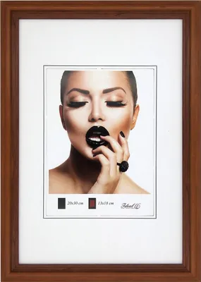 A framed picture of a woman with dramatic makeup.