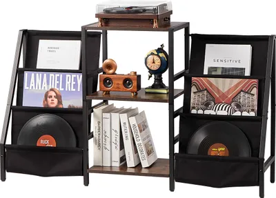 A vinyl record storage and display unit with a turntable on top, books, and decorative items.