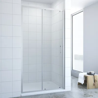 A modern bathroom with a glass shower enclosure.