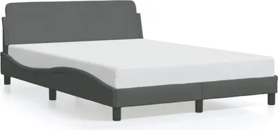 A dark gray fabric bed frame with a white mattress on a white background.