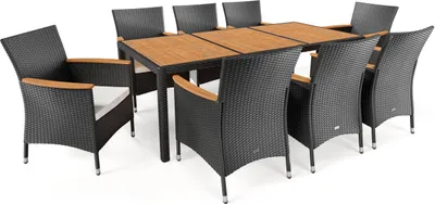 A patio dining set with a wooden table and eight chairs.