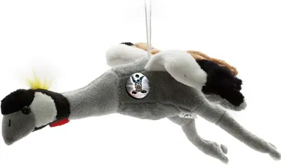 A plush toy of a bird, possibly a crane or heron, suspended by a string against a white background.