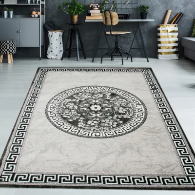 Immagine prodotto di Tappeto moderno con bordo in filato glitterato e motivo a cerchi nei colori grigio, antracite e crema. Dimensioni: 120 x 160 cm