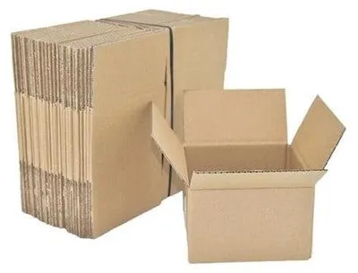A stack of flat-packed cardboard boxes and one open box.
