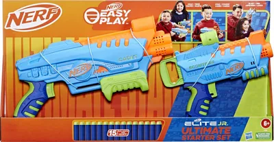 The image shows the packaging of a Nerf Elite Junior Ultimate Starter Set, featuring two blasters and darts. Children are depicted in the background, suggesting the target audience.