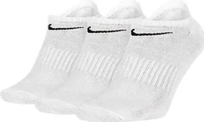 Three white Nike ankle socks are shown in a studio setting against a white background.