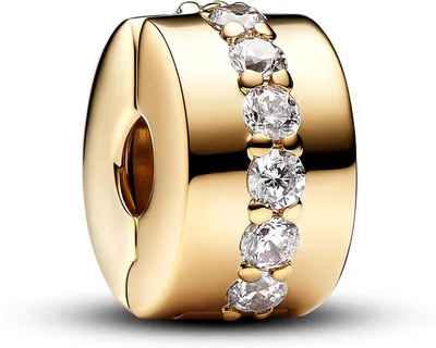 A close-up studio shot of a gold clip charm with clear stones.