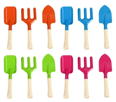 Image de Esschert Design Set d'outils de jardinage pour enfants, râteau/pelle/bêche à main, 6,4x2,5 / 7,4x2,5 / 6,3x3,5 x 20,4 cm, choix des couleurs impossible, orange/bleu/rose