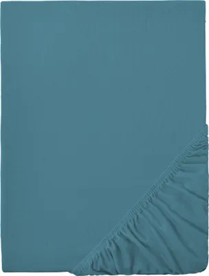 A close-up of a teal fitted sheet, showing the elasticized corner.
