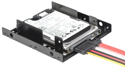 A 2.5-inch hard drive in a black mounting bracket, connected to SATA data and power cables.